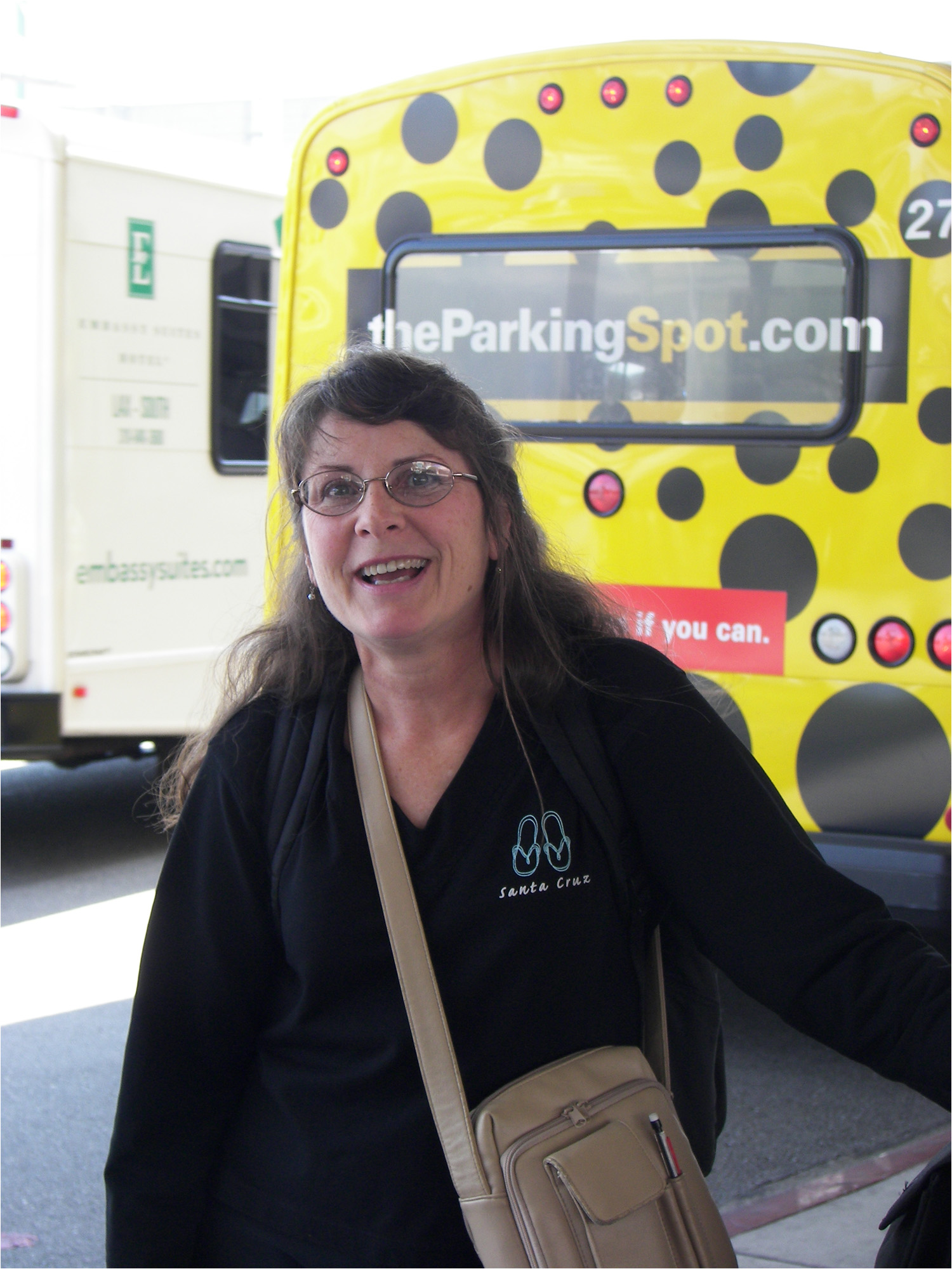 Kath outside LAX terminal @ start of trip waiting for shuttle to the hotel.