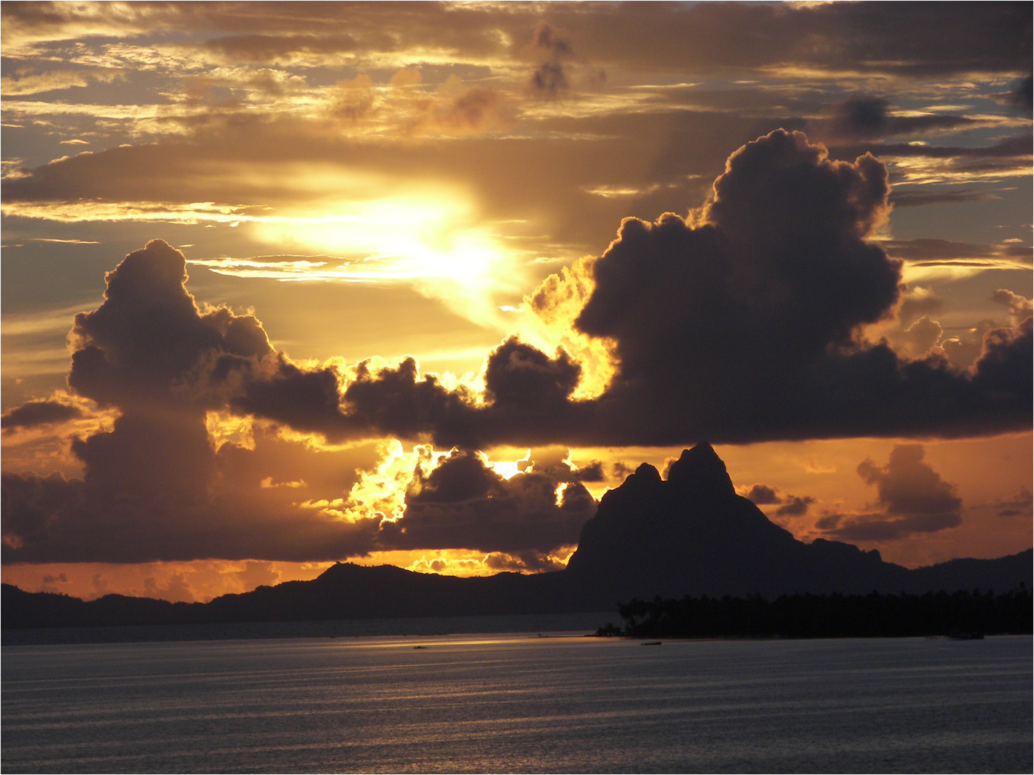 Sunset Moday evening in Tahaa with Bora Bora in the distance