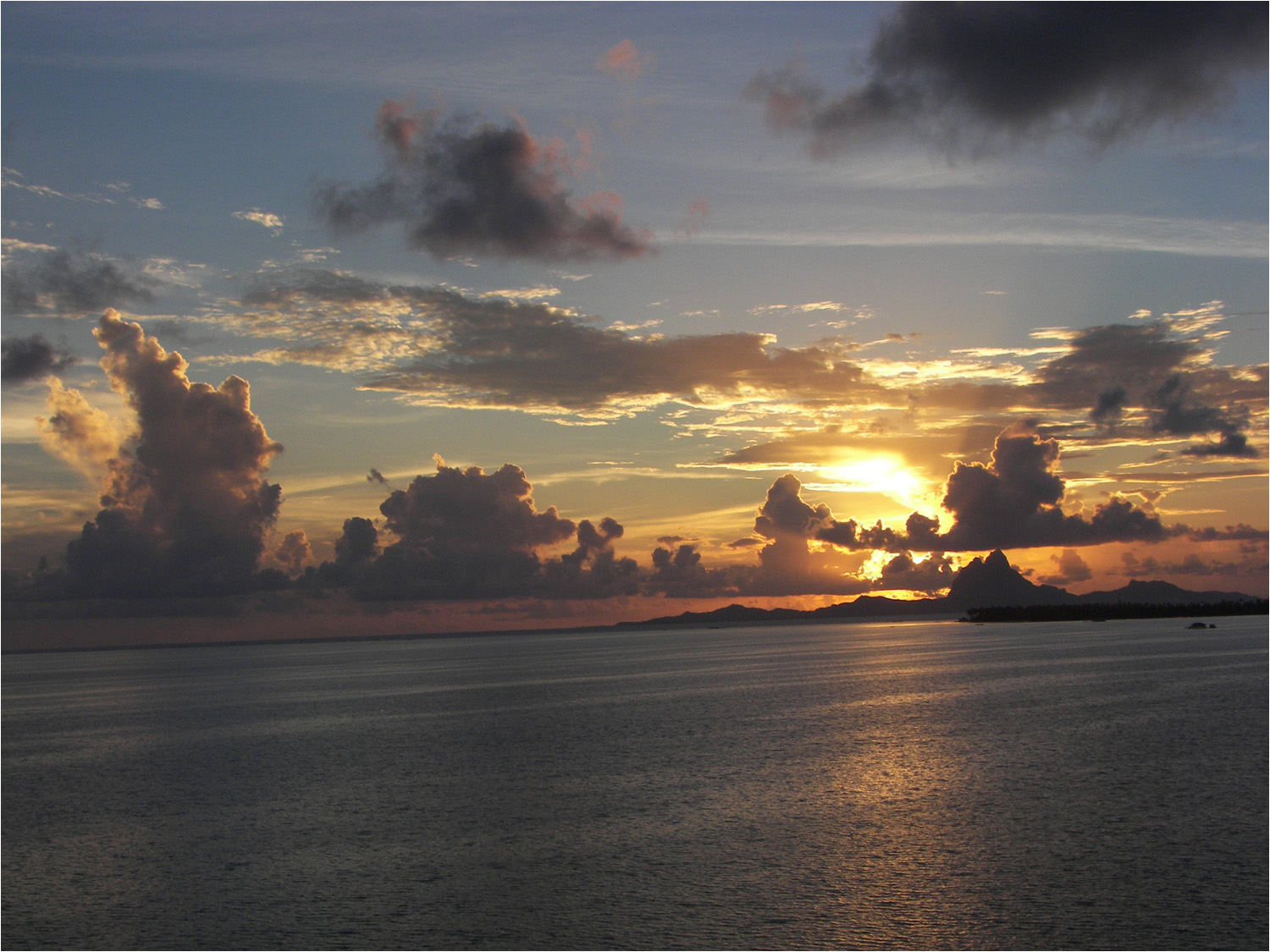 Sunset Moday evening in Tahaa with Bora Bora in the distance