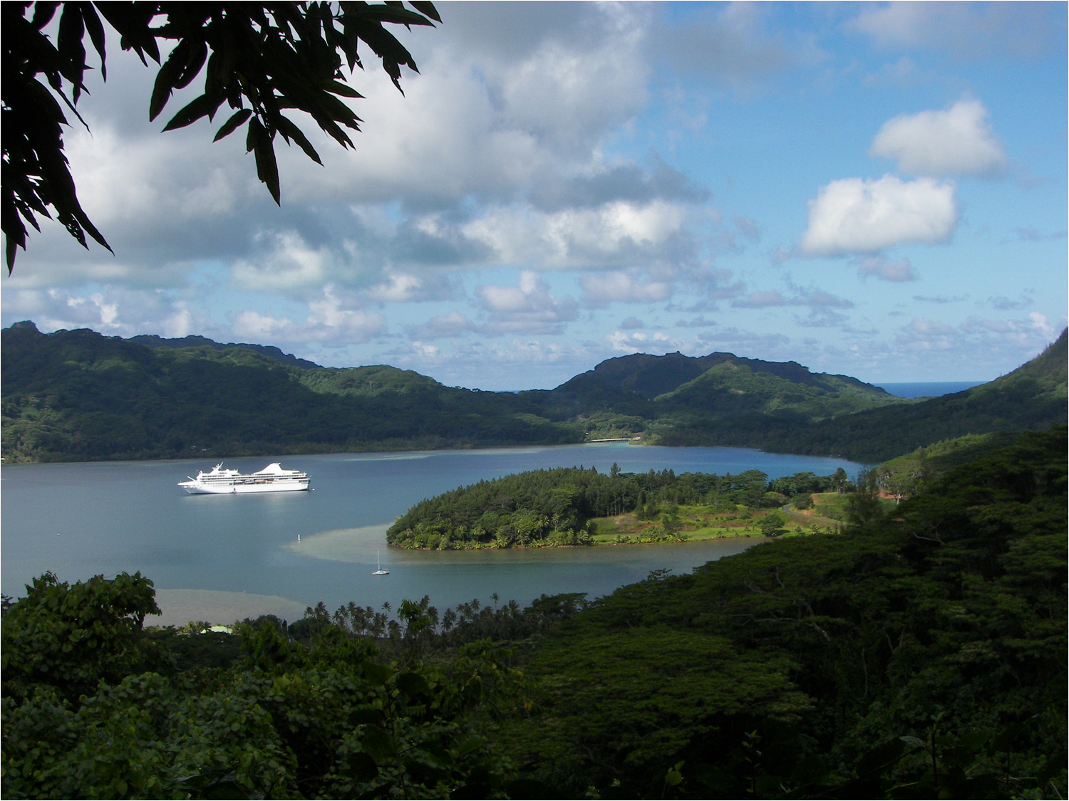 Scenic stop on our tour of Huahine with ship anchored in the lagoon.  Huahine is actually comprised of two islands, Huahine Nui (large) and Huahine Iti (small) The two islands are joined by a bridge in the far background to the right of the ship