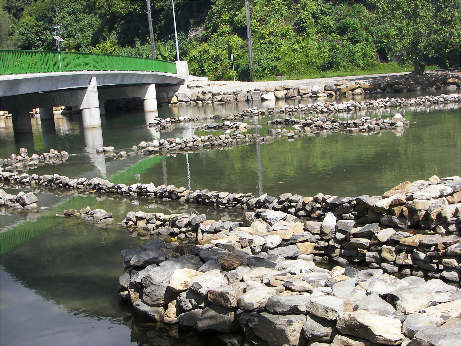 A series of fish traps set up near the bridge which connects the two islands of Huahine.  As much as 400 fish are caught in a single day in these traps.