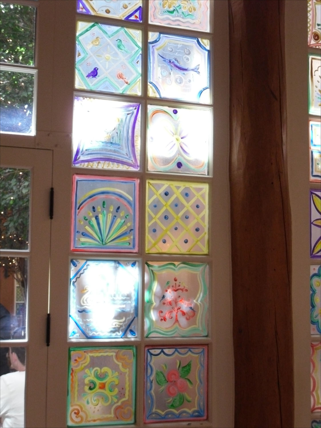 Santa Fe, NM-La Fonda Hotel details-painted window panels around atrium restaurant