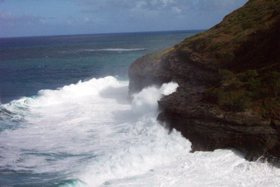 Waves crashing ashore on north side of island near Kilauea  Lighthouse