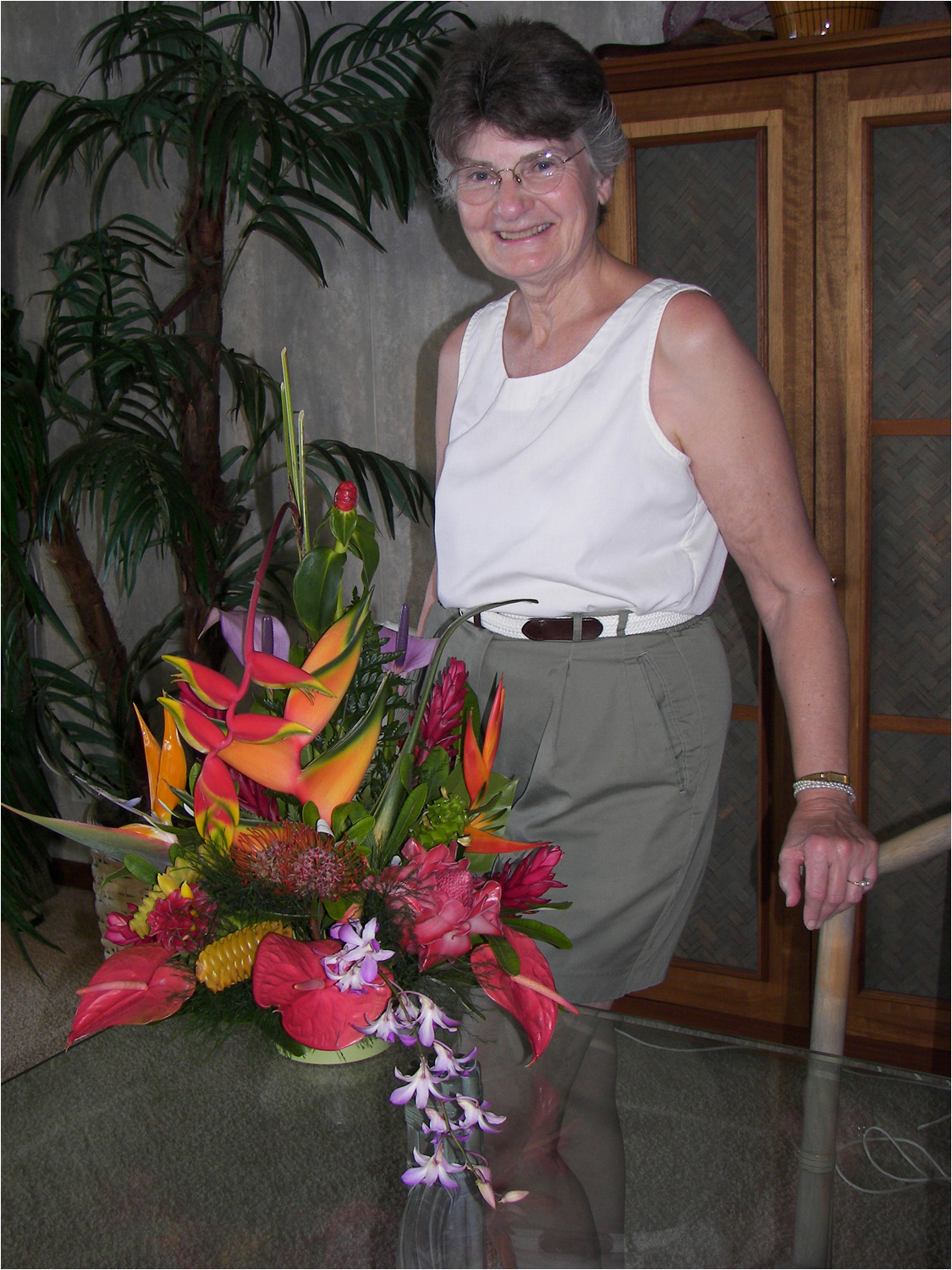 Picture of mom with flowers presented to her by the staff at Poipu Kapili.