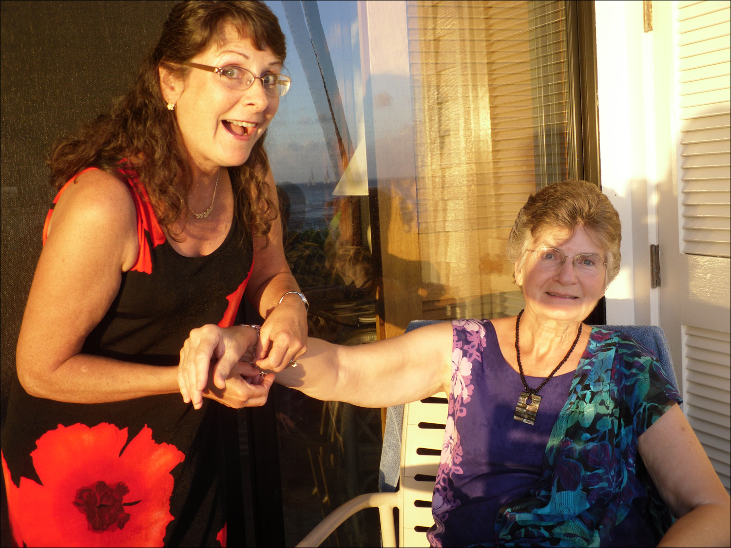 Katherine and mom showing prize bracelet