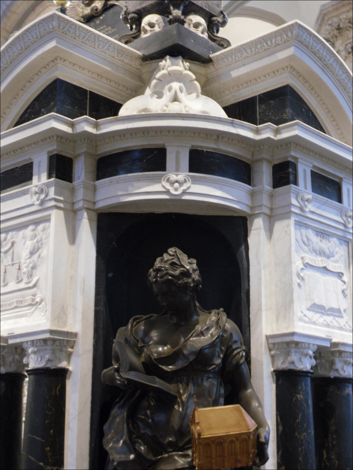 Tomb of William 1of Orange in the Nieuwe Kerk. She has Bible in one hand, church in other