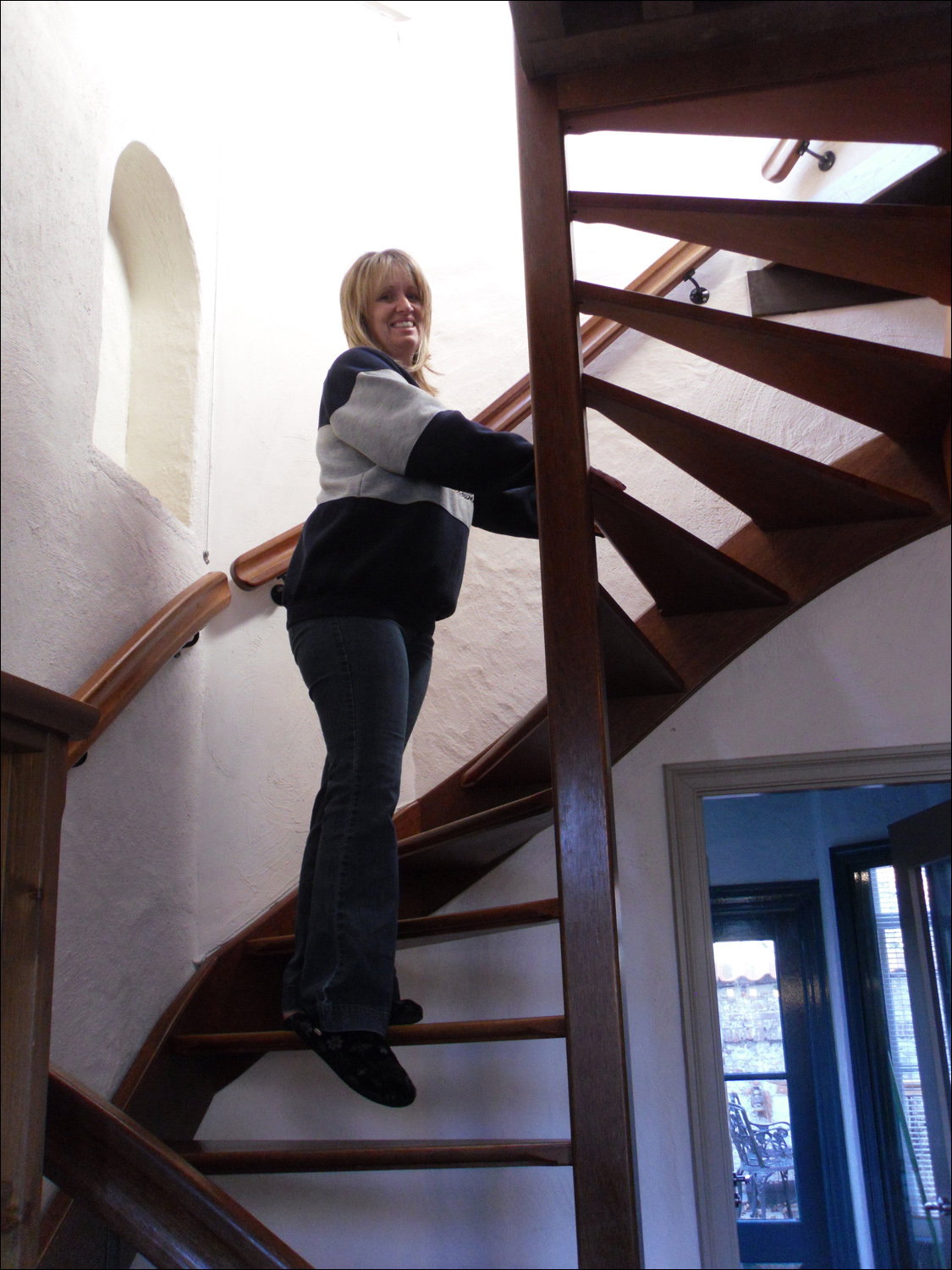 Sondra going upstairs to top floor