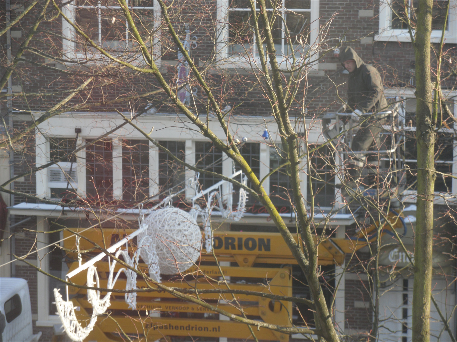 Streetworker on cherrypicker taking down our canal lights